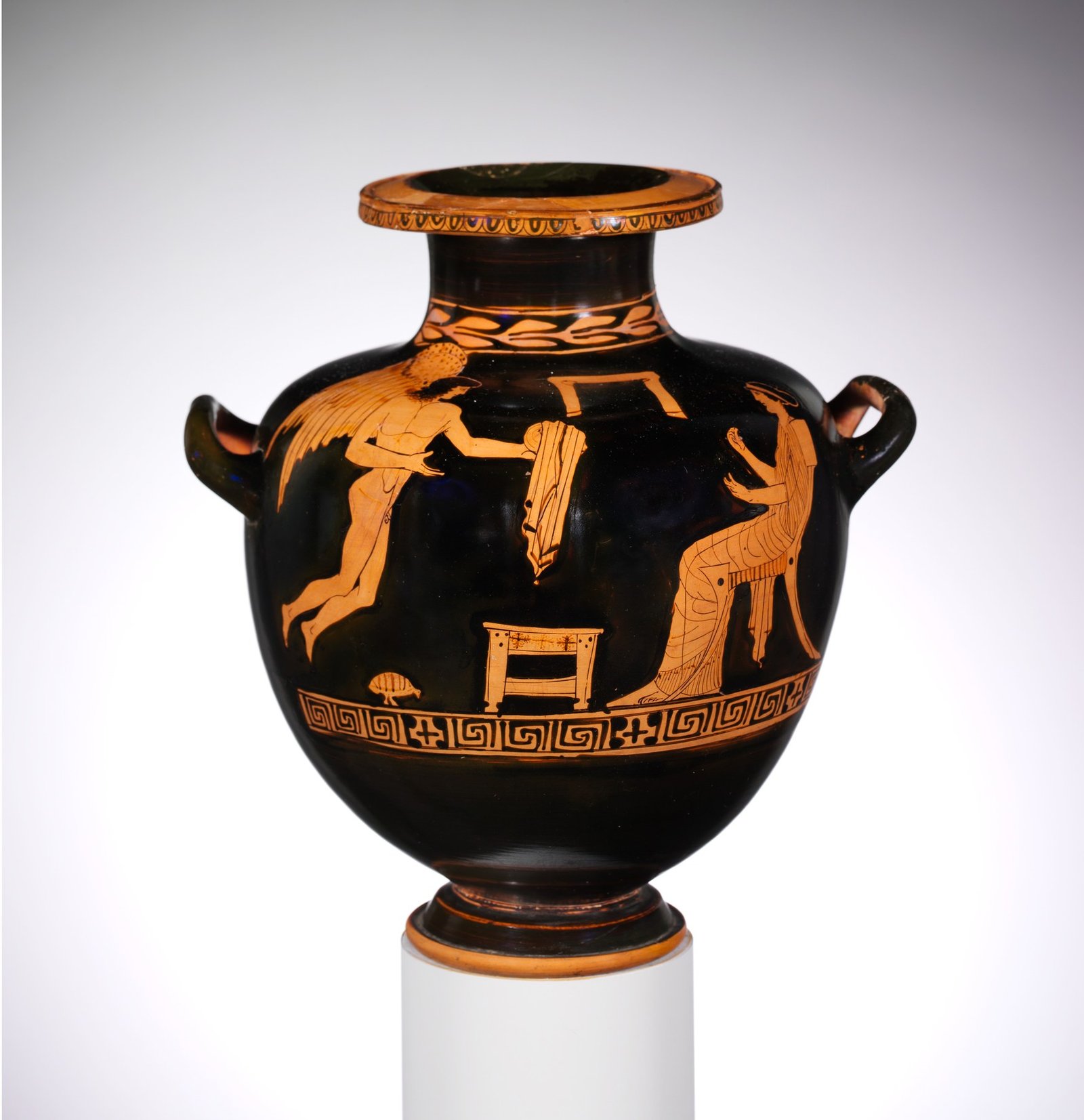 Red-figure Greek water jar showing Eros and a seated woman.